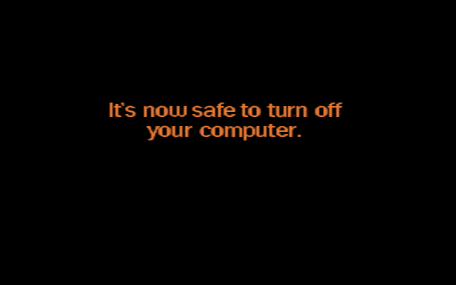 The Windows 98 shutdown screen. Orange text on black, reading "It's now safe to turn off your computer."